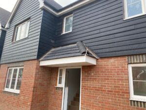 New composite cladding installed to the exterior of a house in Basingstoke.