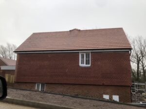 New pitched roof installed with tiles on a new build house in Basingstoke.