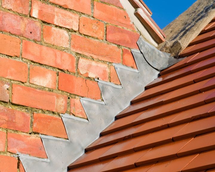 A brick building with lead flashing in the City.